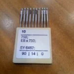 Aguja Ojaladora Reece SE2 Juki SY6482, repuesto de alta precisión diseñado para asegurar costuras duraderas y precisas en máquinas ojaladoras, con fácil instalación y resistencia al desgaste.