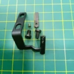 Guarda Aguja GN800 Looper 2-34123 – Componente resistente y preciso para garantizar un rendimiento estable en máquinas de coser industriales.